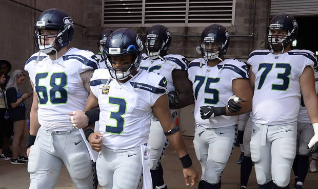 The Seahawks came out with arms linked after the national anthem in Nashville. (AP)...