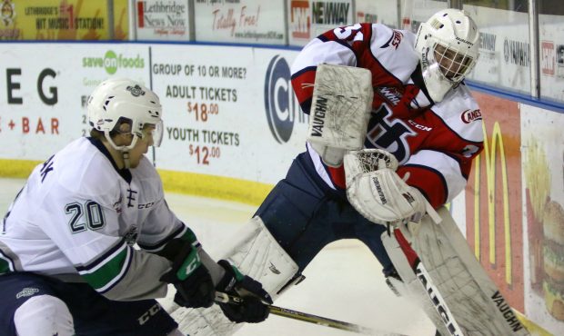 Zack Andrusiak pressures Hurricane's goalie Reece Klassen Sunday night (Cindy Adachi)...