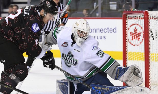 Seattle goalie Liam Hughes makes one of his 25 saves as the Thunderbirds beat Calgary 4-3 (Candice ...