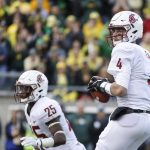 
              Washington State quarterback Luke Falk (4) looks for a receiver against Oregon in an NCAA college football game Saturday, Oct. 7, 2017 in Eugene, Ore. (AP Photo/Thomas Boyd)
            