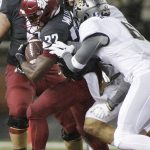 
              Colorado defensive back Evan Worthington, right, and linebacker Drew Lewis, center, tackle Washington State running back James Williams during the first half of an NCAA college football game in Pullman, Wash., Saturday, Oct. 21, 2017. (AP Photo/Young Kwak)
            