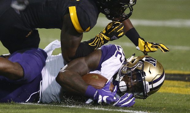 UW needs to look to its running game to get the offense on track, Brock Huard says. (AP)...