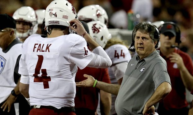 Mike Leach pulled Luke Falk, then didn't go back to him after Tyler Hilinski threw four picks. (AP)...
