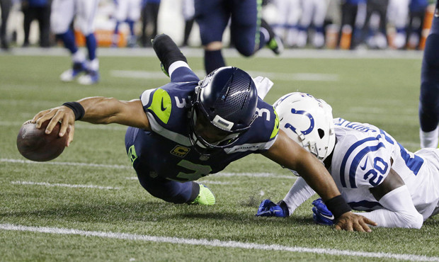 Russell Wilson's rushing touchdown helped get the Seahawks rolling in the second half. (AP)...