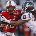 
              Utah running back Zack Moss (2) is tackled by Washington State linebacker Jahad Woods (13) in the first half during an NCAA college football game, Saturday, Nov. 11, 2017, in Salt Lake City. (AP Photo/Rick Bowmer)
            