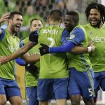 
              FILE - In this Nov. 3, 2017, file photo, Seattle Sounders forward Clint Dempsey (2) is greeted by teammates after he scored the first of two goals in the second half of the second leg of an MLS soccer Western Conference semifinal against the Vancouver Whitecaps in Seattle. Dempsey has been named the MLS Comeback Player of the Year after a heart condition in 2016 put his career in jeopardy. Dempsey was the choice after scoring 12 goals in the 2017 regular season and leading Seattle to a second-place finish in the MLS Western Conference. The Sounders will face Houston in the Western Conference finals beginning Nov. 21, 2017. (AP Photo/Ted S. Warren, file)
            