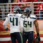 
              Seattle Seahawks middle linebacker Bobby Wagner (54) celebrates after intercepting a pass with teammate Byron Maxwell (41) during the first half of an NFL football game against the San Francisco 49ers Sunday, Nov. 26, 2017, in Santa Clara, Calif. (AP Photo/John Hefti)
            