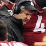 
              Washington State head coach Mike Leach, center, speaks with his players during the first half of an NCAA college football game against Stanford in Pullman, Wash., Saturday, Nov. 4, 2017. (AP Photo/Young Kwak)
            