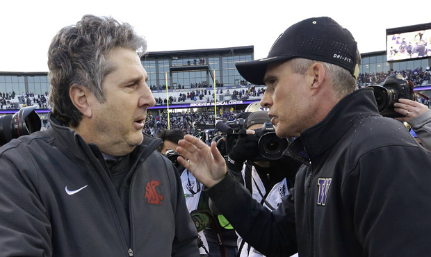 Despite a higher ranking, Mike Leach's Cougars are 10-point underdogs to Chris Petersen's Huskies. ...