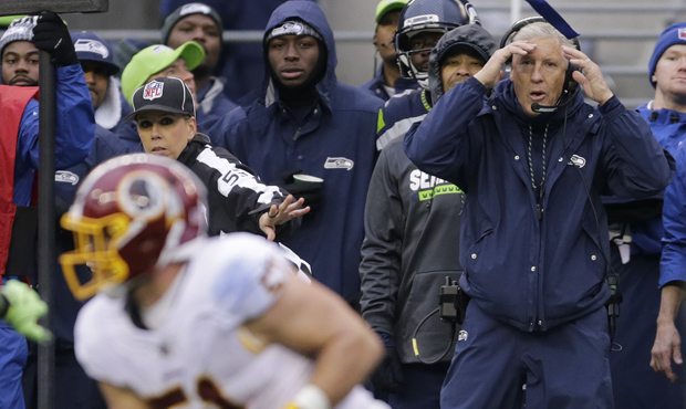 Seattle Seahawks head coach Pete Carroll, right, reacts on the sideline after Washington Redskins i...