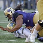 
              FILE - In this Oct. 28, 2017, file photo, Washington's Vita Vea sacks UCLA quarterback Josh Rosen in the first half of an NCAA college football game, in Seattle. Vea was selected to the AP All-Conference Pac-12 team announced Thursday, Dec. 7, 2017. (AP Photo/Elaine Thompson, File)
            