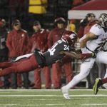 
              FILE - In this Oct. 21, 2017, file photo, Washington State safety Jalen Thompson (34) tackles Colorado running back Phillip Lindsay (23) during the first half of an NCAA college football game, in Pullman, Wash. Thompson was selected to the AP All-Conference Pac-12 team announced Thursday, Dec. 7, 2017. (AP Photo/Young Kwak, File)
            