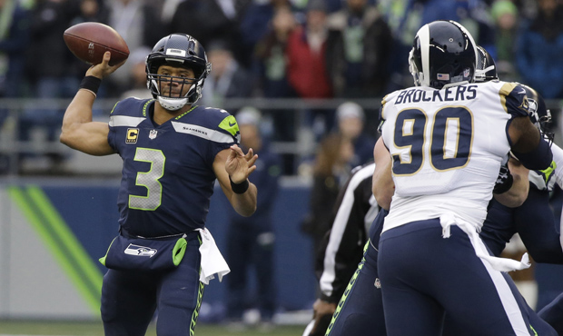 Russell Wilson and the Seahawks' backs are up against the wall to get a playoff spot. (AP)...
