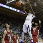 Washington forward Noah Dickerson (15) dunks above Washington State forward Robert Franks, right, and guard Malachi Flynn, left, Sunday, Jan. 28, 2018, in the first half of an NCAA college basketball game in Seattle. (AP Photo/Ted S. Warren)