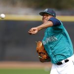 Seattle Mariners starting pitcher Ariel Miranda throws in the outfield during a baseball spring training workout, Monday, Feb. 19, 2018, in Peoria, Ariz. (AP Photo/Charlie Neibergall)