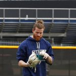 Seattle Mariners outfielder Ben Gamel flips the baseball into his glove as he works out with a few teammates at the Seattle Mariners spring training complex Wednesday, Feb. 14, 2018, in Peoria, Ariz. (AP Photo/Ross D. Franklin)