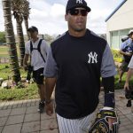 Seattle Seahawks NFL football quarterback Russell Wilson walks off the field after doing drills at New York Yankees baseball spring training camp, Monday, Feb. 26, 2018, in Tampa, Fla. (AP Photo/Lynne Sladky)