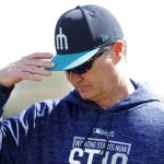 Seattle Mariners manager Scott Servais walks on the field during a baseball spring training workout, Monday, Feb. 19, 2018, in Peoria, Ariz. (AP Photo/Charlie Neibergall)