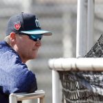 Seattle Mariners manager Scott Servais watches batting practice during a baseball spring training workout, Monday, Feb. 19, 2018, in Peoria, Ariz. (AP Photo/Charlie Neibergall)