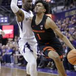 Oregon State's Stephen Thompson Jr., right, reacts while being fouled by Washington's Jaylen Nowell during the first half of an NCAA college basketball game Thursday, March 1, 2018, in Seattle. (AP Photo/Elaine Thompson)