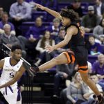 Oregon State's Ethan Thompson, right, leaps as he defends against Washington's Jaylen Nowell during the first half of an NCAA college basketball game Thursday, March 1, 2018, in Seattle. (AP Photo/Elaine Thompson)