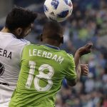 Seattle Sounders defender Kelvin Leerdam (18) battles with Montreal Impact defender Victor Cabrera (2) for a header in the first half of an MLS soccer match, Saturday, March 31, 2018, in Seattle. Leerdam was sent off with a red card for violent conduct later in the half. The Impact won 1-0. (AP Photo/Ted S. Warren)
