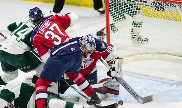 Tri-City goalie Patrick Dea fights to make a save during the Americans 5-3 victory over the Everett...