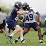 Seattle Seahawks linebacker Shaquem Griffin (49) squares off against tight end Will Dissly, left, during a drill in NFL football practice, Thursday, May 24, 2018, in Renton, Wash. (AP Photo/Ted S. Warren)