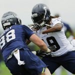 Seattle Seahawks linebacker Shaquem Griffin, right, squares off against tight end Will Dissly (88), during a drill in NFL football practice, Thursday, May 24, 2018, in Renton, Wash. (AP Photo/Ted S. Warren)