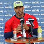 Seattle Seahawks quarterback Russell Wilson talks to reporters following NFL football practice, Thursday, May 24, 2018, in Renton, Wash. (AP Photo/Ted S. Warren)