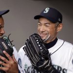 
              Seattle Mariners' Ichiro Suzuki, right, and Robinson Cano laugh before the team's baseball game against the Oakland Athletics on Wednesday, May 2, 2018, in Seattle. (AP Photo/Elaine Thompson)
            
