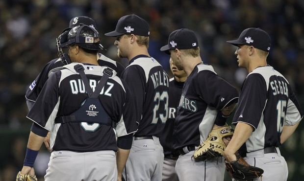 Kyle Seager (far right) was part of the Mariners' 2012 trip to play Oakland in Japan. (AP)...
