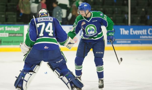 Swift Current's Stuart Skinner celebrates with Max Patterson after his 1-0 shutout in Game 4 Wednes...