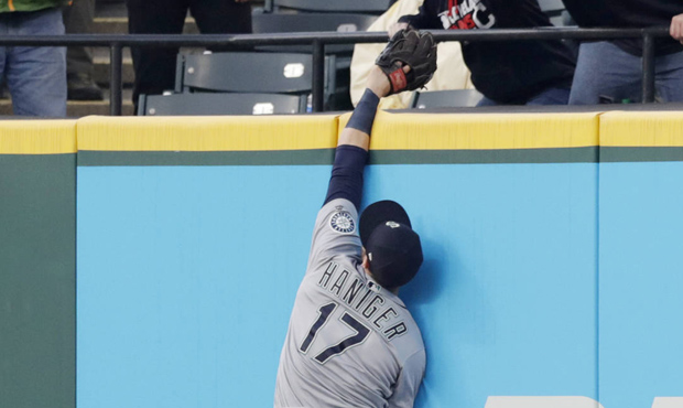 Mariners outfielder Mitch Haniger makes a leap at the wall. (AP)...
