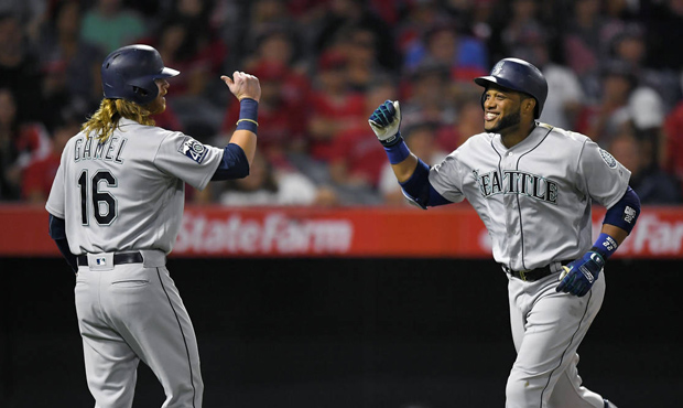 Seattle Mariners' Robinson Cano, right, is congratulated by Ben Gamel after hitting a two-run home ...