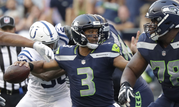 Russell Wilson was 4 of 5 passing in his short time in the Seahawks' preseason opener. (AP)...