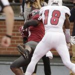 Washington State wide receiver Easop Winston Jr. (8) catches a pass for a touchdown against Eastern Washington defensive back D'londo Tucker (18) during the first half of an NCAA college football game in Pullman, Wash., Saturday, Sept. 15, 2018. (AP Photo/Young Kwak)