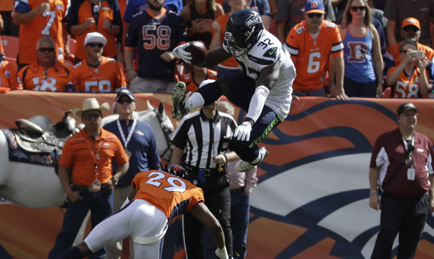 Chris Carson had an impressive hurdle but just seven carries in the Seahawks' loss. (AP)...