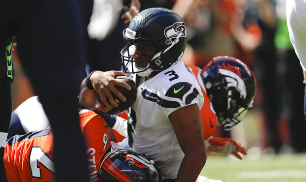 Russell Wilson was sacked six times in the Seahawks' 27-24 loss to the Broncos. (AP)...