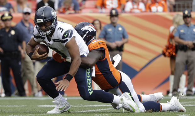 Russell Wilson and the Seahawks' offense came up short in the fourth quarter. (AP)...