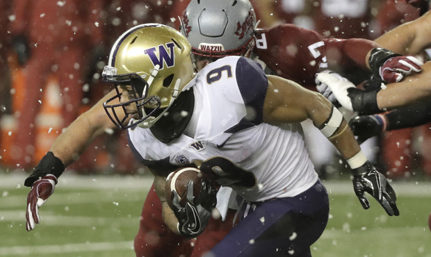 Gaskin runs No. 16 UW Huskies past No. 7 WSU 28-15 in snowy Apple Cup