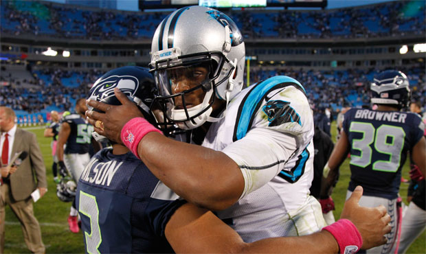 Seahawks QB Russell Wilson and Carolina's Cam Newton have a lot of history as opponents. (AP)...