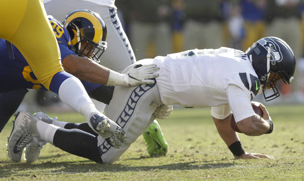 Russell Wilson was sacked four times in the Seahawks' 36-31 loss to the Rams. (AP)...