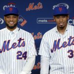 
              Robinson Cano, left, and Edwin Diaz pose for photos at a CitiField news conference, in New York, Tuesday, Dec. 4, 2018. The Mets acquired eight-time All-Star second baseman Robinson Cano and major league saves leader Edwin Diaz from the Seattle Mariners in a seven-player trade Monday. (AP Photo/Richard Drew)
            