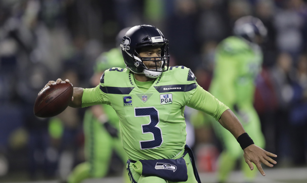 Seattle Seahawks quarterback Russell Wilson throws against the Minnesota Vikings in the first half ...