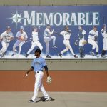 Seattle Mariners pitcher Robin Leyer walks to a practice field during spring training baseball practice Tuesday, Feb. 12, 2019, in Peoria, Ariz. (AP Photo/Charlie Riedel)