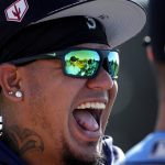 Seattle Mariners starting pitcher Felix Hernandez (34) laughs with teammates during spring training baseball practice Tuesday, Feb. 12, 2019, in Peoria, Ariz. (AP Photo/Charlie Riedel)