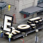 Massive letters that had spelled out "Safeco Field" are stacked atop a flatbed trailer after being removed by a crane over the home plate entrance of the Seattle Mariners' ballpark Wednesday, Feb. 13, 2019, in Seattle. Under a new 25-year naming rights deal, the Mariners will call the stadium T-Mobile Park. The Mariners' ballpark has been known as Safeco Field since it opened in 1999 as part of a 20-year agreement. Safeco Insurance and the Mariners announced in June 2017 that the agreement wouldn't be renewed following the 2018 season. (AP Photo/Elaine Thompson)