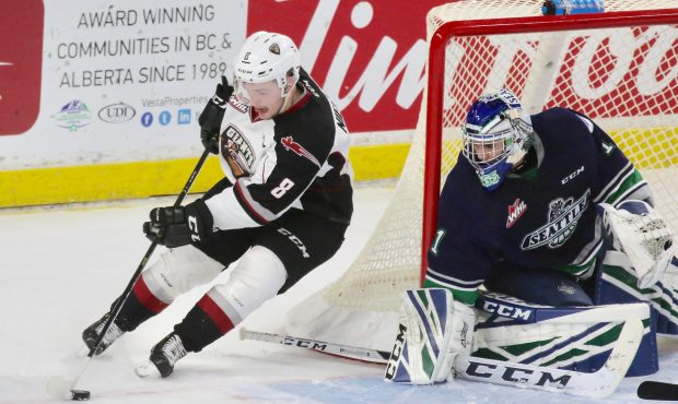 Vancouver's Tristen Nielsen tries to score on Seattle's Roddy Ross during Game 1 of the WHL Playoff...