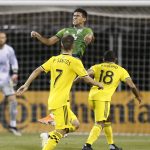 Seattle Sounders' Xavier Arreaga, top, heads the ball near Columbus Crew's Pedro Santos, left, and Robinho during the second half of an MLS soccer match Saturday, July 6, 2019, in Columbus, Ohio. The Sounders won 2-1. (AP Photo/Jay LaPrete)